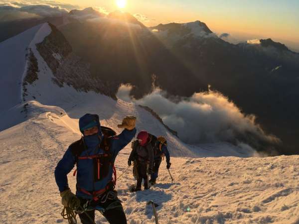 Ascent to Nadelhorn, the sun rising behind us